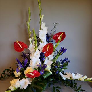 SY0078- Red, White, and Blue Custom Tropical Funeral Arrangement