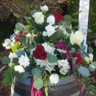 CF09287-Wine and White Flower Arrangement on Wine Barrel