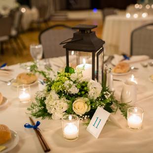 RF1283-Lantern Centerpiece with Greenery, White Hydrangea and Roses