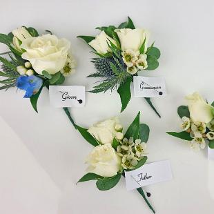BF0802-White Spray Rose, Thistle and Wax Flower Boutonnieres